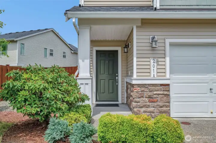 End unit with side yard and 2 car garage,