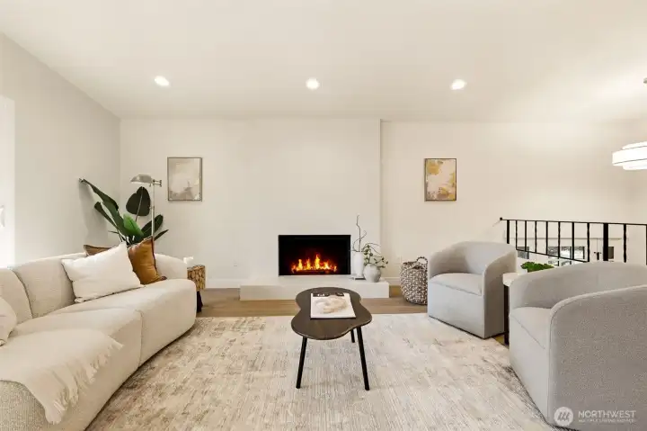 Living room with wood burning fireplace.