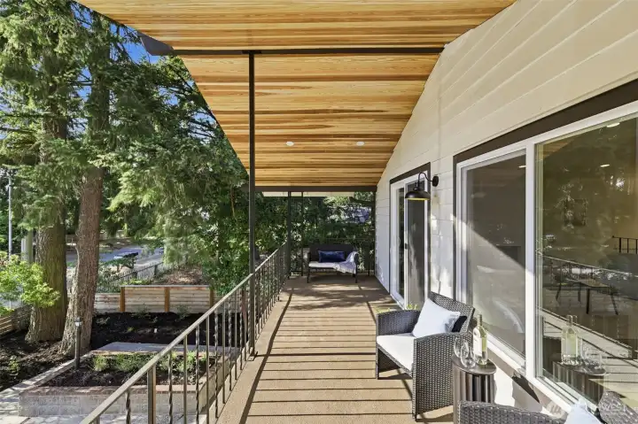 Balcony with new wood awning and overhead lighting.