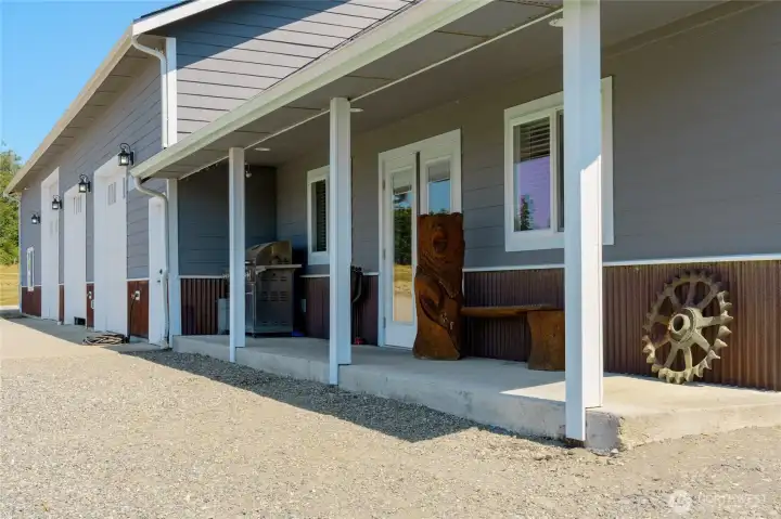 Covered porch keeps the weather off and provides space for seating and grilling. Covered porch keeps the weather off and provides space for seating and grilling.