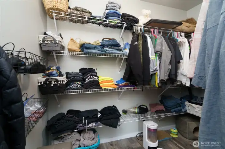 Primary closet is spacious with wire shelving for storage. Primary closet is spacious with wire shelving for storage.