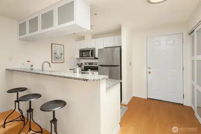 Countertop seating and large pantry to the right