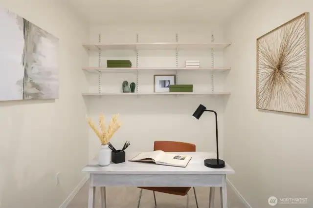 Den area perfect for an at home office and/or a space for guests! Fresh carpet just installed.
