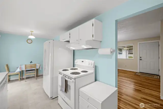 Kitchen and front door in the background