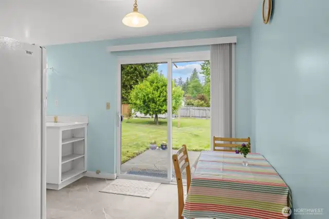 Sliding door entry to the fenced backyard