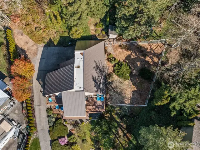 Birds eye view of property and fenced yard portion