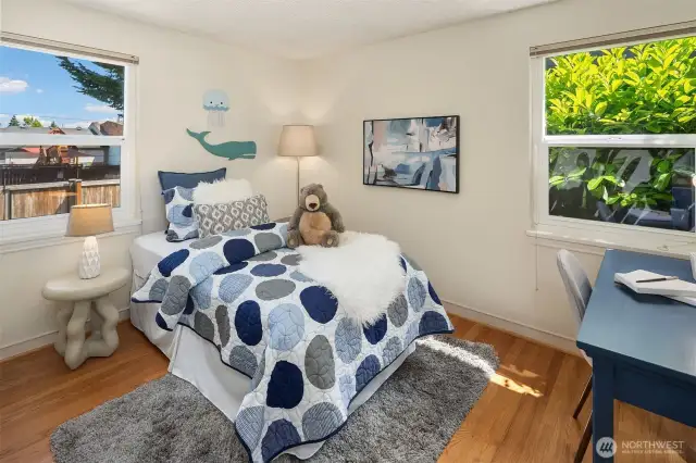 The second main floor bedroom overlooks the backyard and is also outfitted with a Closets By Design closet system.