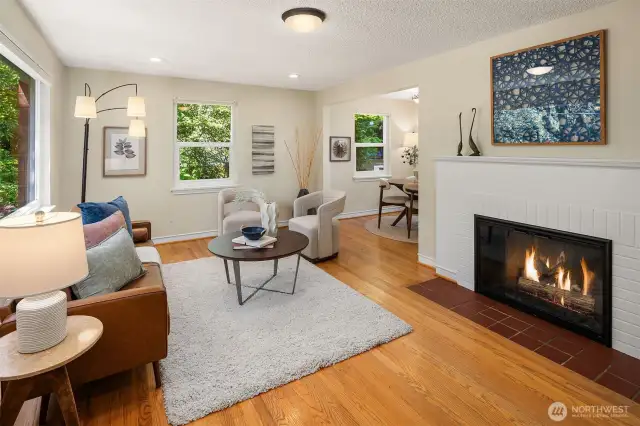 Lovely hardwood floors and a gas fireplace grace the large living room.