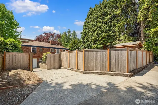 Alley parking spot. Note the new fence, driveway gate and side gate.