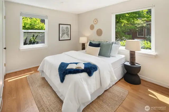 First of two bedrooms on the main floor. This one with two closets outfitted with Closets By Design built-ins.