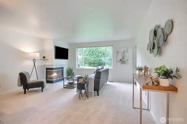 Spacious living room with cozy fireplace,
