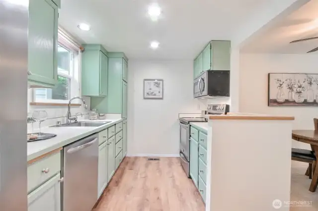 Kitchen with painted cabinets and stainless appliances
