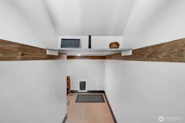 Use for storage or as a doggie hotel. This has a doggie door that leads to an enclosed pet relief area with drainage.