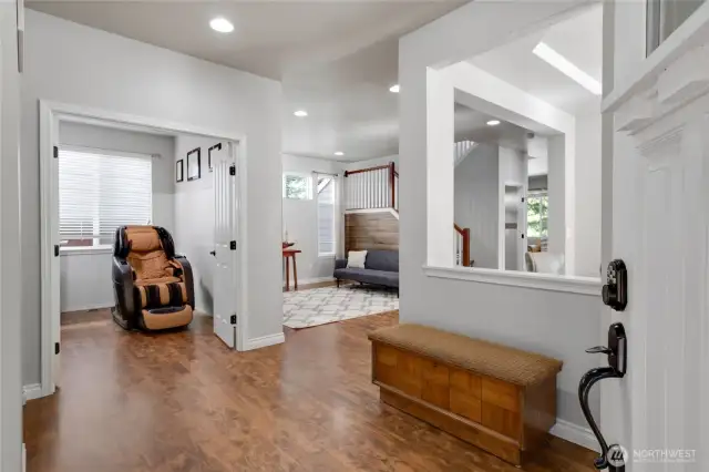 Entry area viewing the office which has double doors.