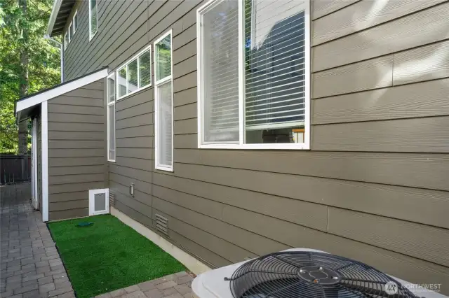 Specialty pet relief area with door to under stairs area.
