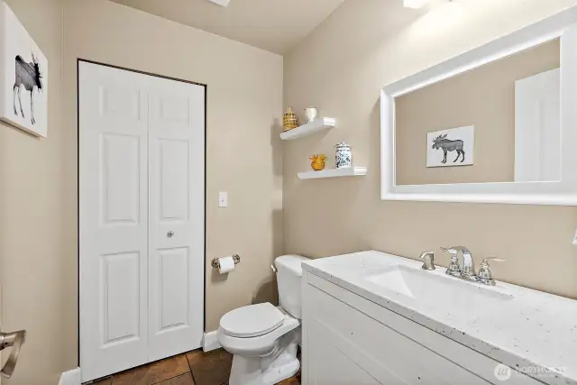 Powder room off Kitchen on main level.