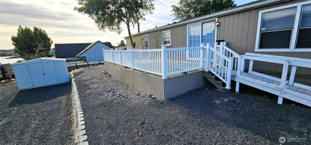 Deck and driveway with large shed
