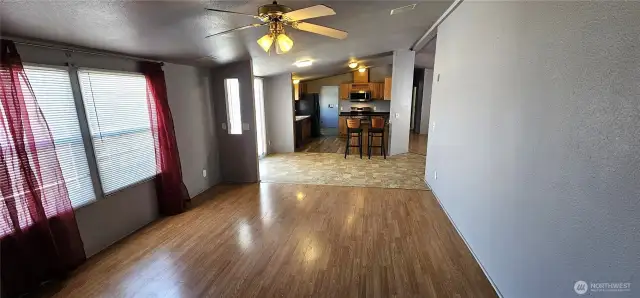Living room view into dining area and kitchen