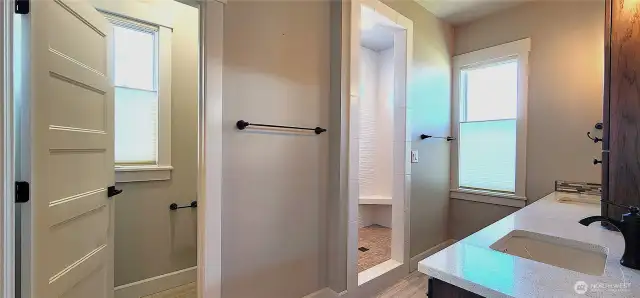 Primary bath, with enclosable commode area, separate shower with built-in seat