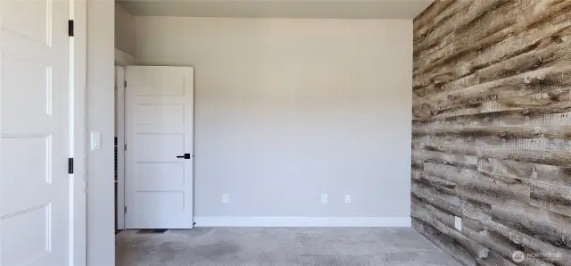 Bedroom 2 on the main floor with French door closet, including built-in safe for your valuables