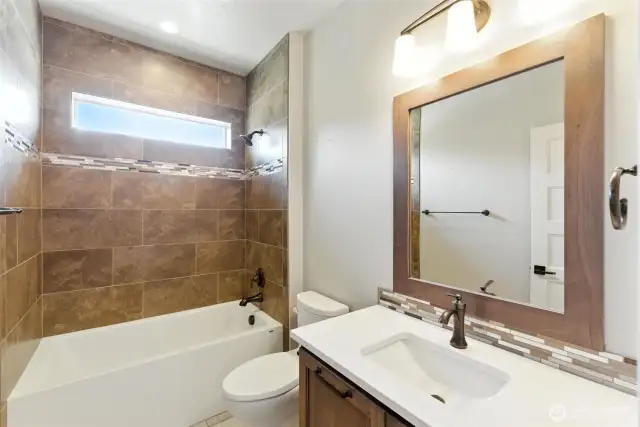 Guest bath located between bedroom 2 and the kitchen