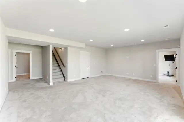 Rec room with storage room to the left and bedroom 3 to the right