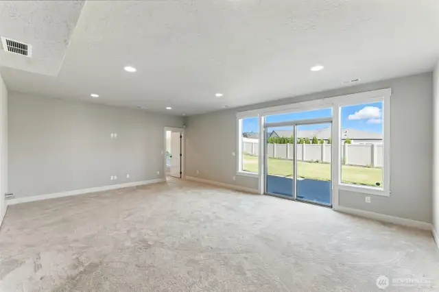 Rec room looking out onto the patio and backyard