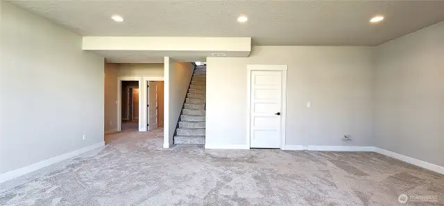 Rec room, with bedrooms 4 and 5 off to the left as well as a storage room
