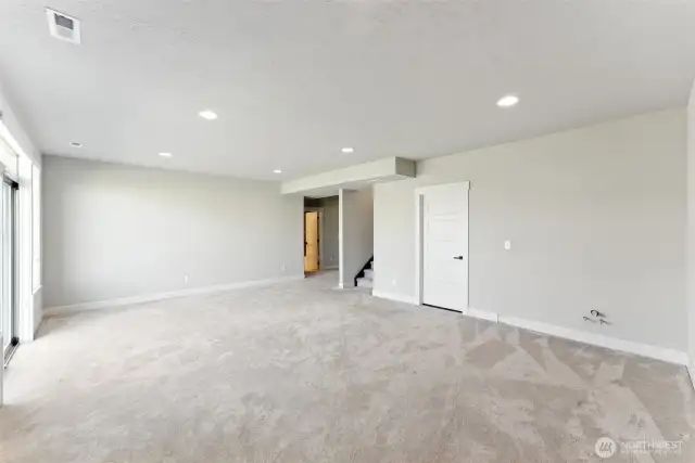Rec room with door to patio off to the left