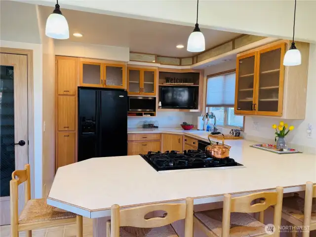 The kitchen stools, microwave and the TV stay with the house.