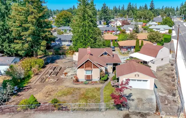 This shows the 2 garages..The barn like garage has a finished space upstairs used as an art studio.