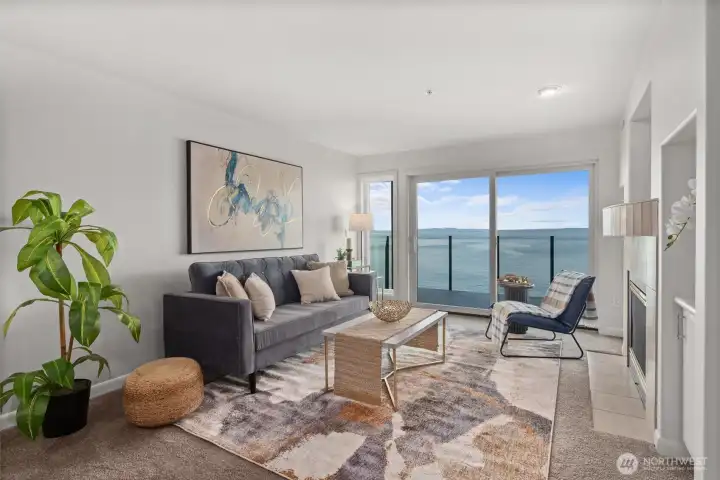 Panoramic Views from Sunrise to Sunset!  Unblockable vistas await from this immaculate 2-bed, 2-bath condo in the heart of Alki. Whether you're enjoying morning coffee or evening sunsets, the views from the open living area & primary suite are truly unforgettable. A cozy 2-sided gas fireplace brings warmth & ambiance to both spaces. Stay cool all summer w/central A/C & relax into the carefree beach lifestyle in this move-in-ready home. Just a short stroll to Alki Beach, w/ its restaurants, coffee shops, & lively pubs or hop on the nearby Downtown Water Taxi for an E-Z commute - or to catch a Mariners game! This well-maintained building features a stylish lobby, modern elevator, & is managed by a well-established HOA. Aloha from Alki!