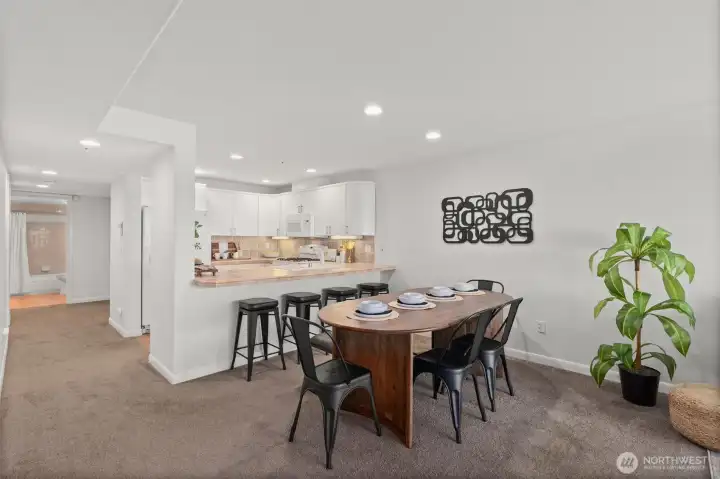 Another view of the dining area and kitchen.