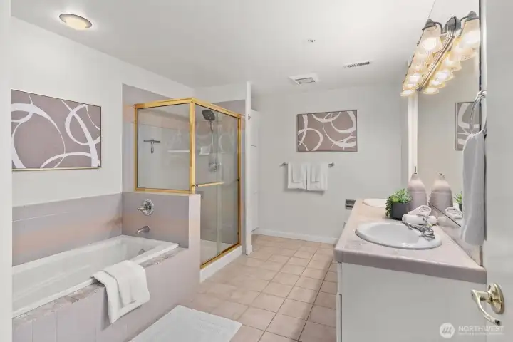 Primary bath with dual sinks, soaking tub and separate shower.