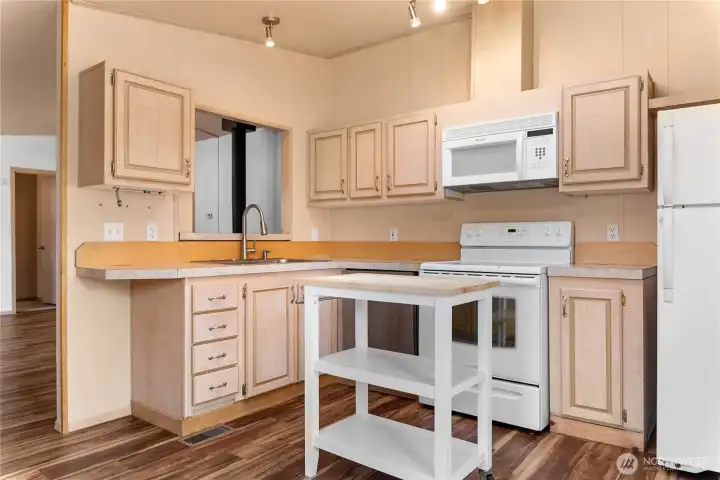 Perfect size kitchen with appliances and a skylight for natural light.