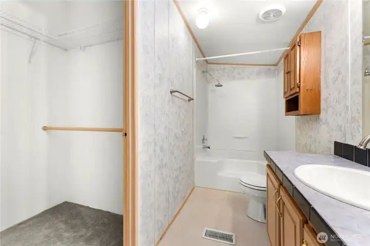 Walk in closet off of the primary bathroom.