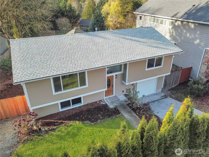 Inviting split-level home with fresh exterior updates, a spacious front yard, and great curb appeal.