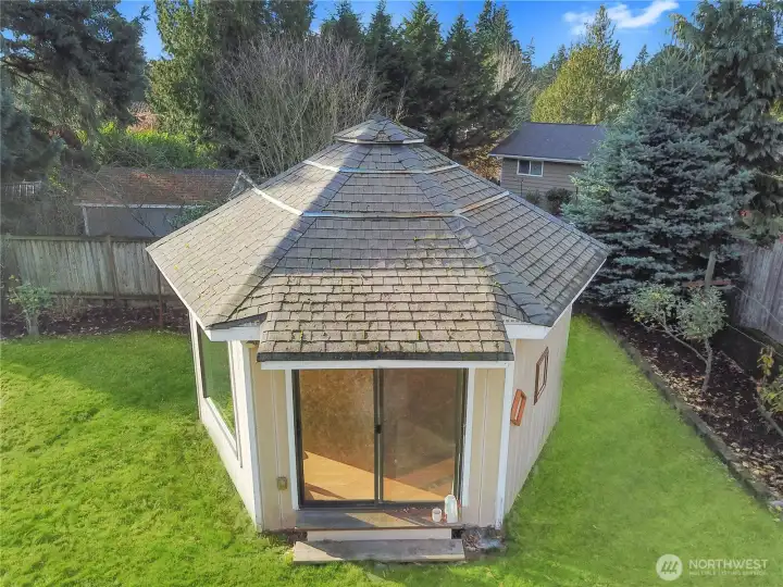 Private studio with sliding door entry—originally built as an artist’s space and perfect for a home office, gym, or creative retreat.”