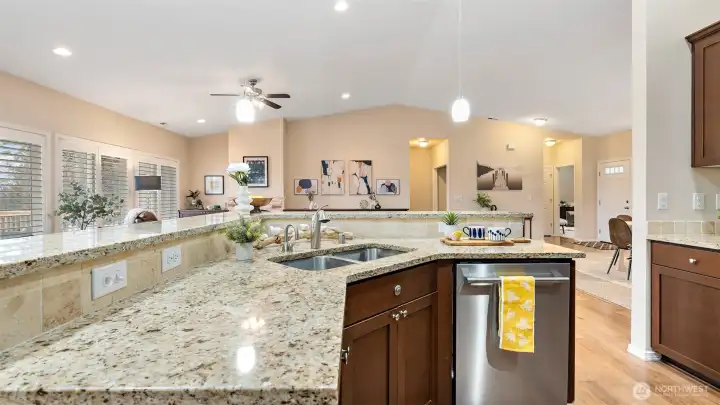 Stunning kitchen opens up to the rest of the living spaces with stainless steel appliances and views for days