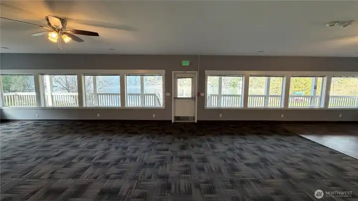 Clubhouse One features features wall-to-wall windows, abundant natural light, and flexible space for gatherings and events.