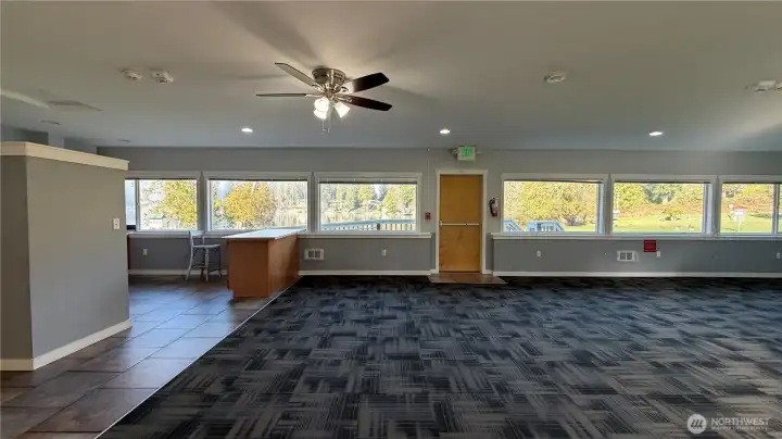 Clubhouse Two features expansive windows, flexible gathering space, and views of the surrounding grounds. It also features a full kitchen for all your gathering needs.