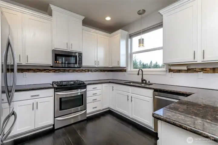 granite counter tops and ample cabinet storage