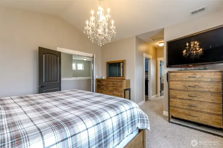 vaulted ceilings and French doors in the primary bedroom.
