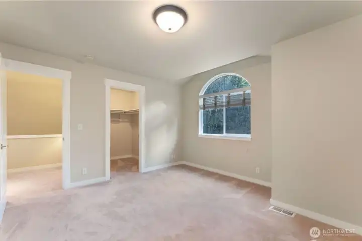 Another shot of the upstairs bedroom with the walk-in closet. Photo depicts the room without furniture; seller furnishings are currently in the home.