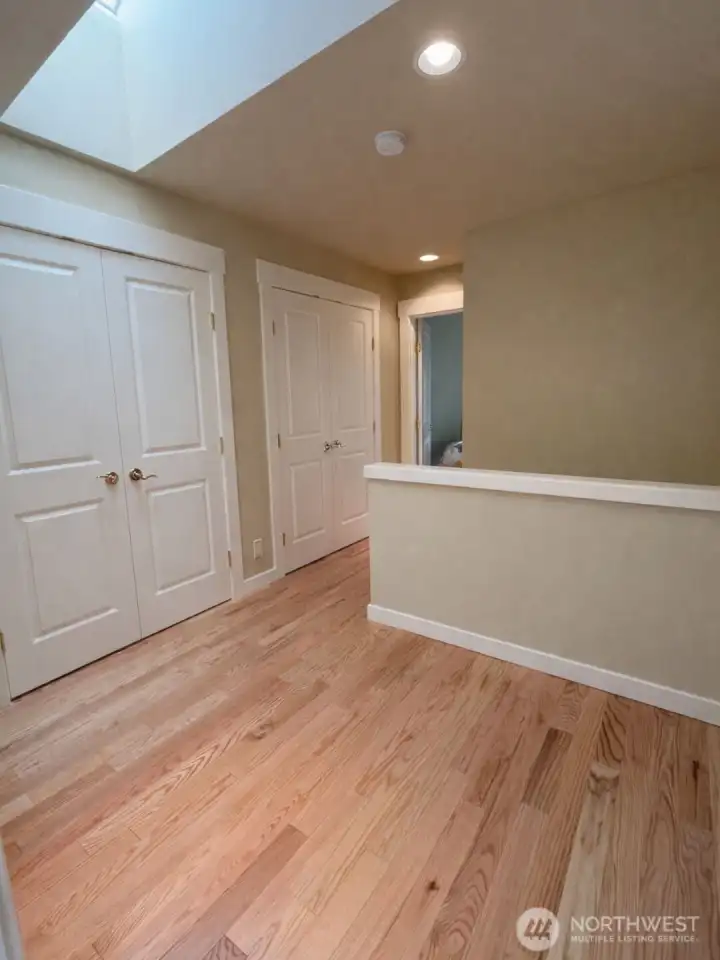 Upstairs landing has closets for additional storage options.