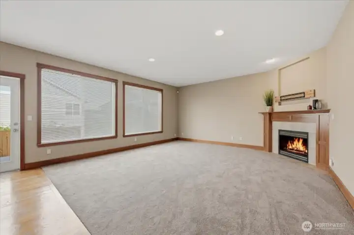 South facing grand living room with natural light and gas fireplace