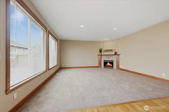 Neutral color tones, new carpet and gas fireplace compliment this great room.