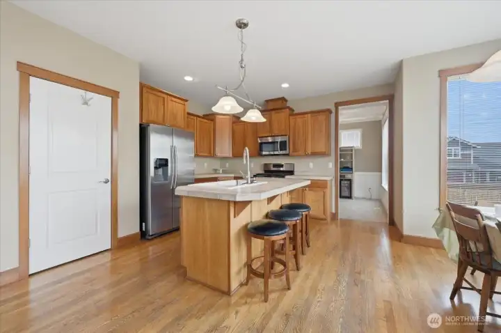 Kitchen with breakfast bar is in the heart of the house.