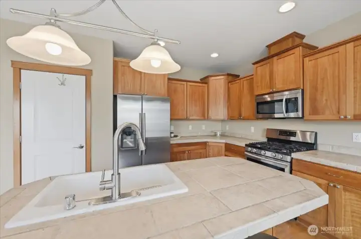 Kitchen Island with double sink completes the triangle.