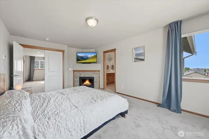 Enjoy the main bedroom with french doors, gas fireplace and Mount Ranier Views